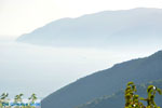 JustGreece.com Foggy Skopelos seen from Alonissos town | Sporades | Greece  - Foto van JustGreece.com