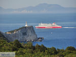 JustGreece.com Bijenkasten at Cape Lefkatas, daarachter een Superfast Ferry Photo 3 - Lefkada (Lefkas) - Foto van JustGreece.com