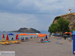 Anaxos beach with on the hill the bekende windmolen - Photo JustGreece.com